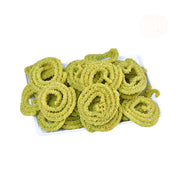 A pile of green Karuvepillai Murukku, a type of Indian snack, on a white background.