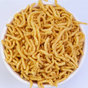 A bowl filled with Mini Karasev, which are crispy sev noodles.