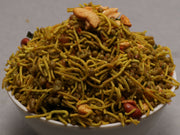 A bowl of Pudina Mixtuer, which appears to be a crispy stir-fried snack with nuts and seasonings.