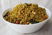 A bowl of Pudhina Mixture, featuring crispy noodles with chickpeas and spices.