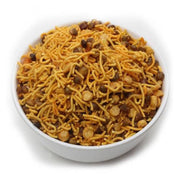 White bowl filled with a mix of yellow noodles and brown chickpeas on a white background