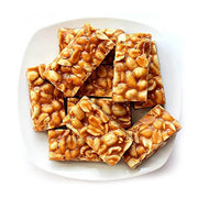 A plate of Kadalai Mittai, traditional sweet made from roasted groundnuts and jaggery.